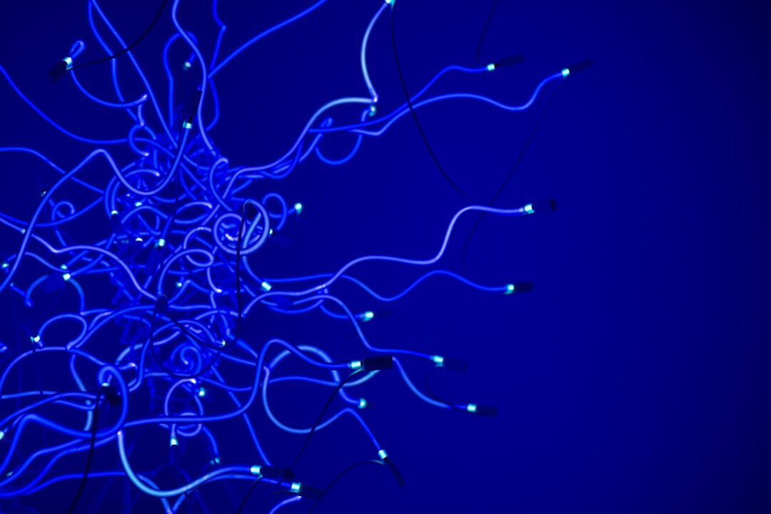 Abstract visualization of artificial intelligence neural network with glowing blue nodes