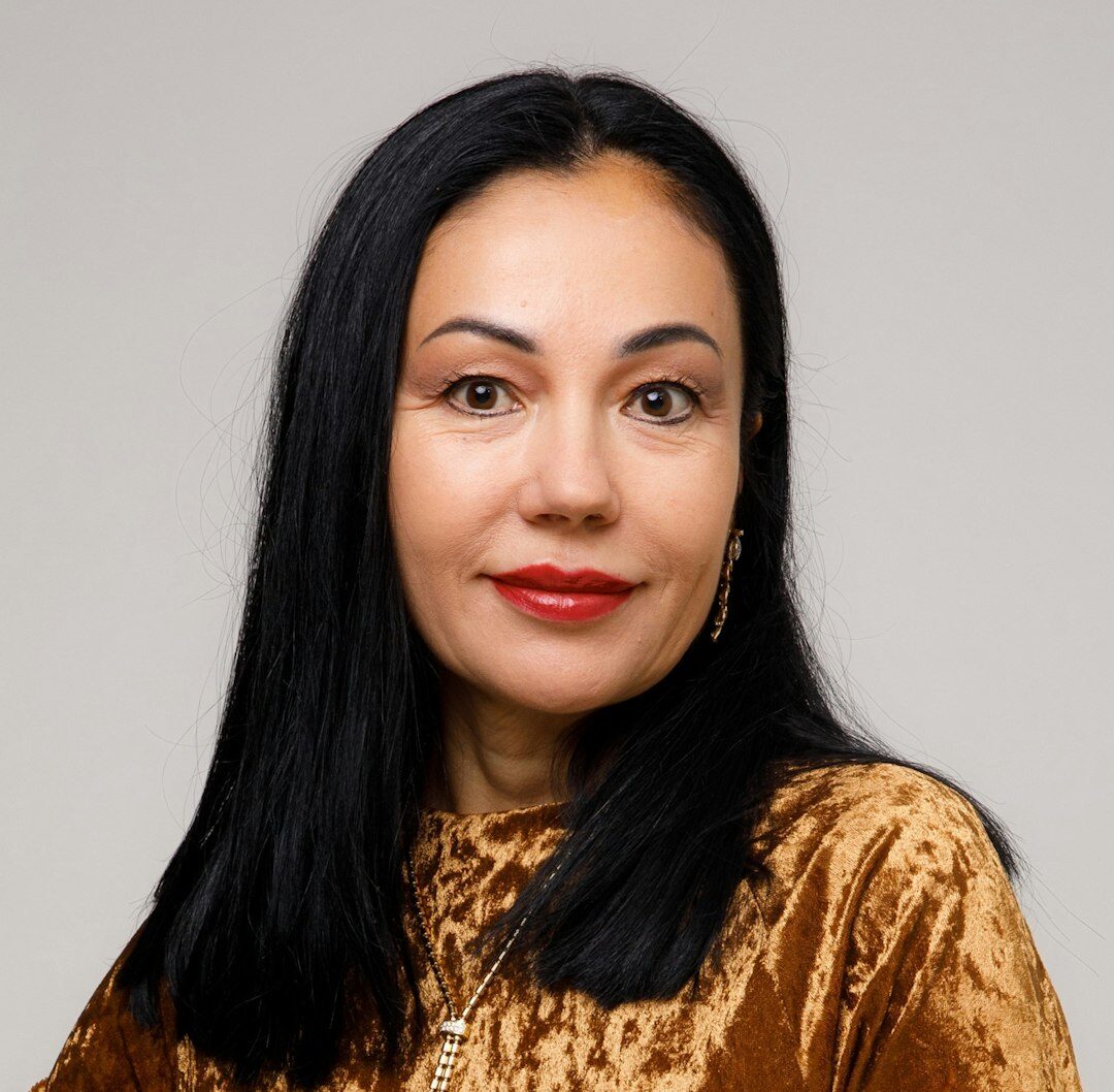 Professional Turkish female tech journalist smiling confidently