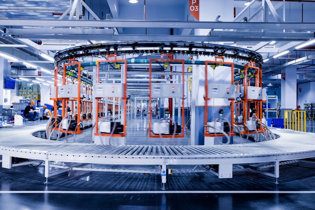 Industrial automation robot arm working on assembly line in modern factory